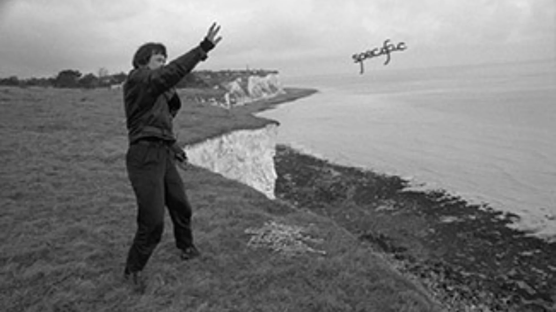 Lady throwing the word specific from a cliff