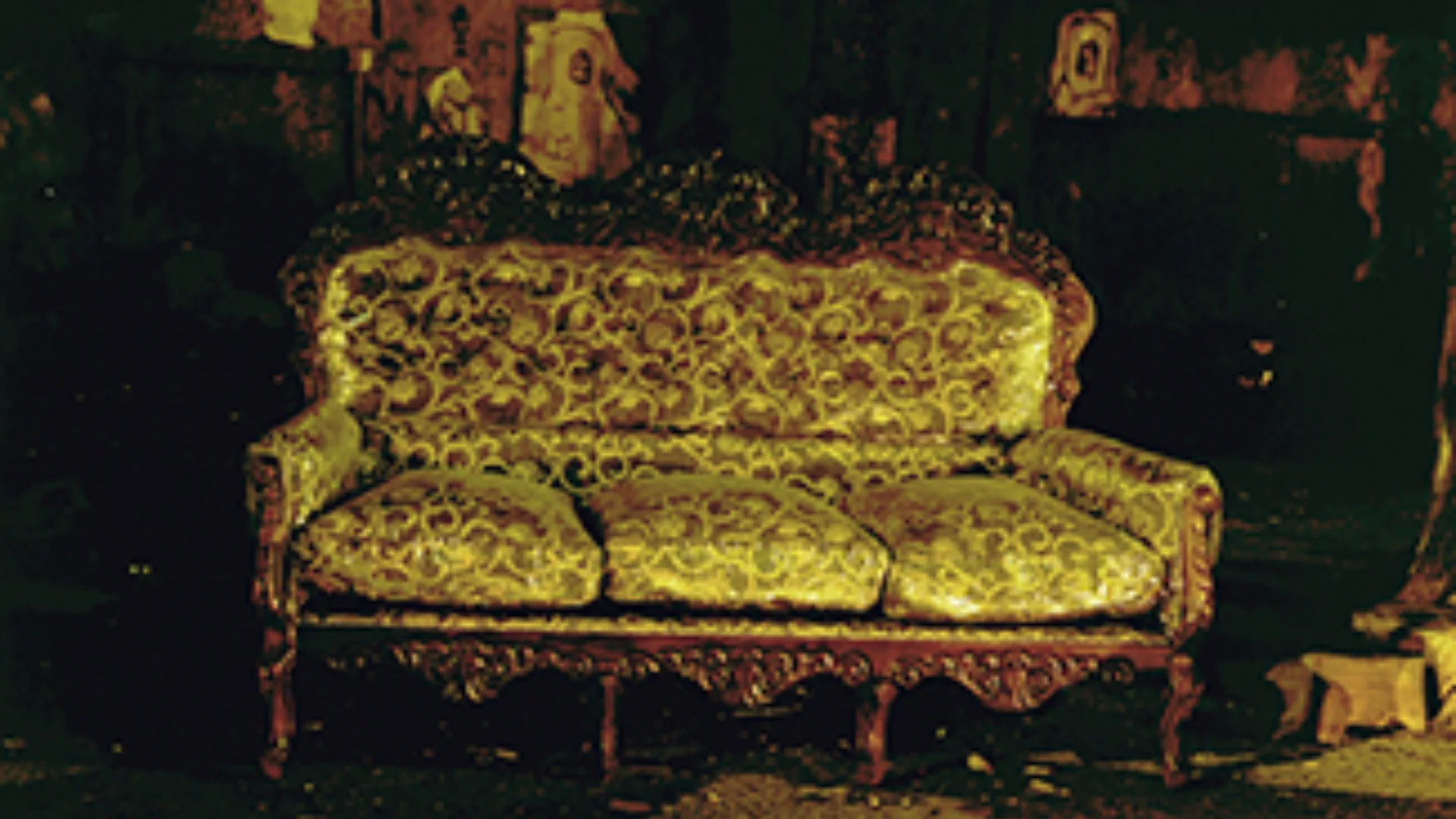 Antique sofa covered in gold material