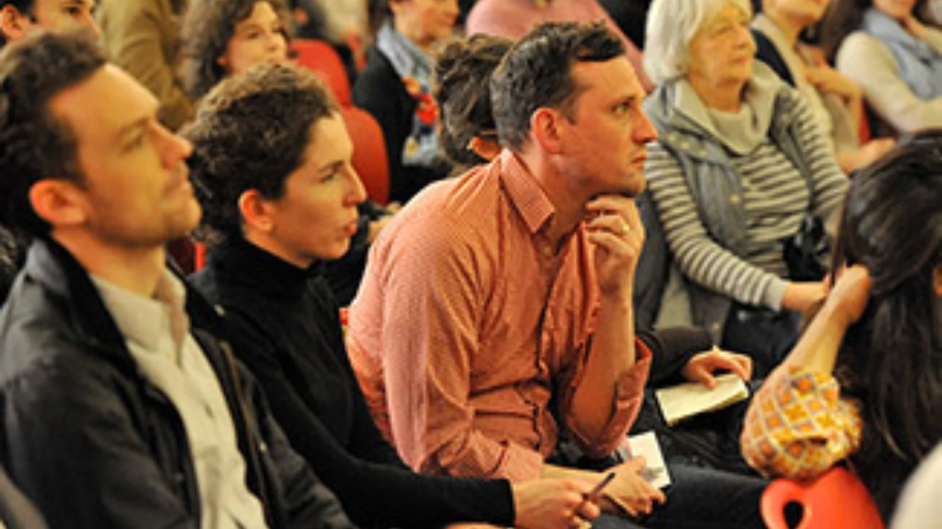 People sitting attending a presentation