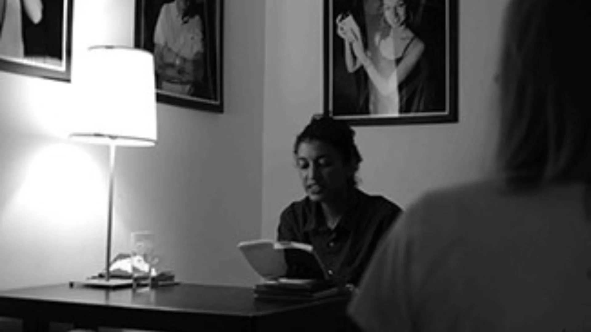 Artist sitting in a dark room