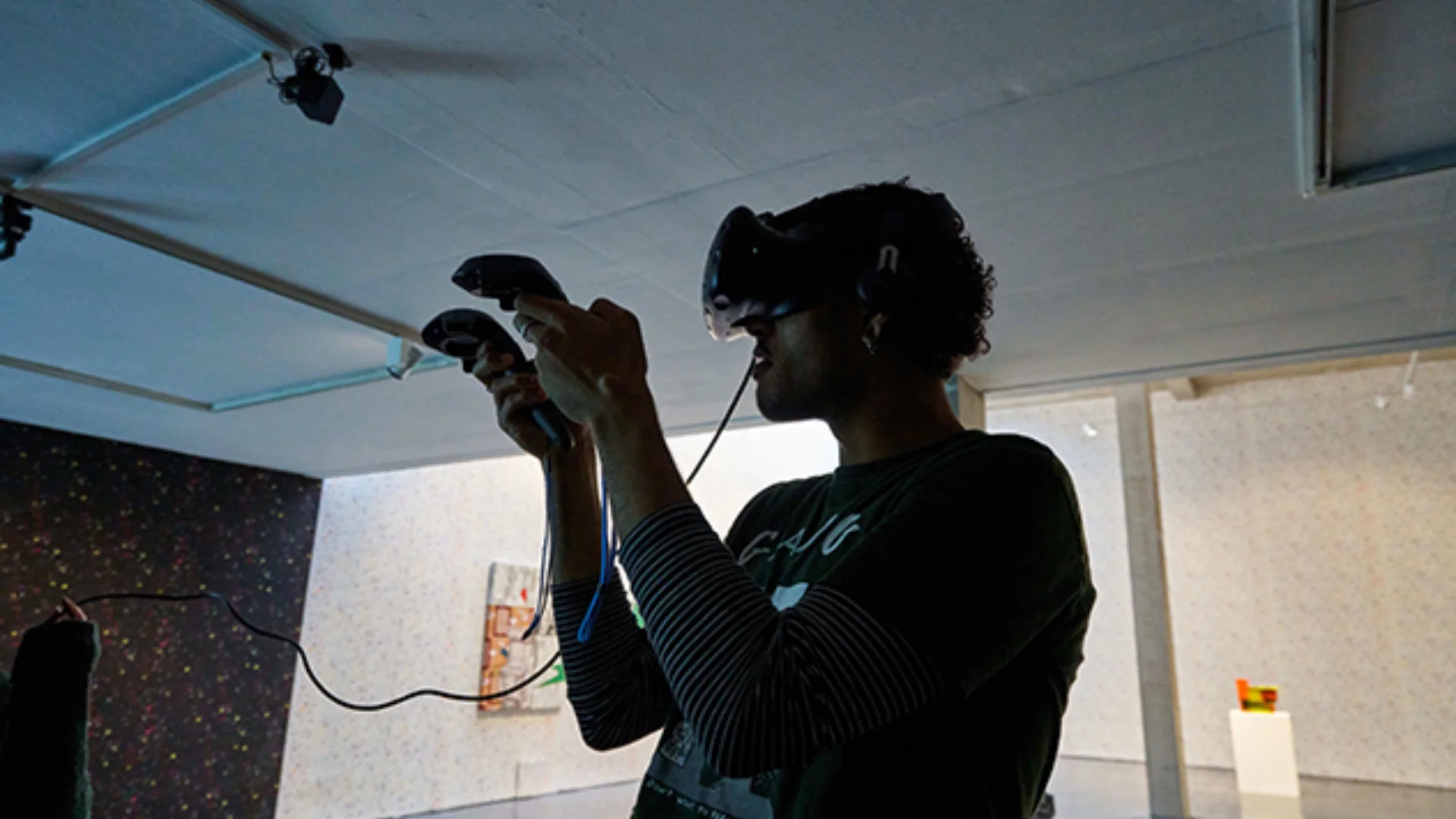 Person with VR Headset and handsets