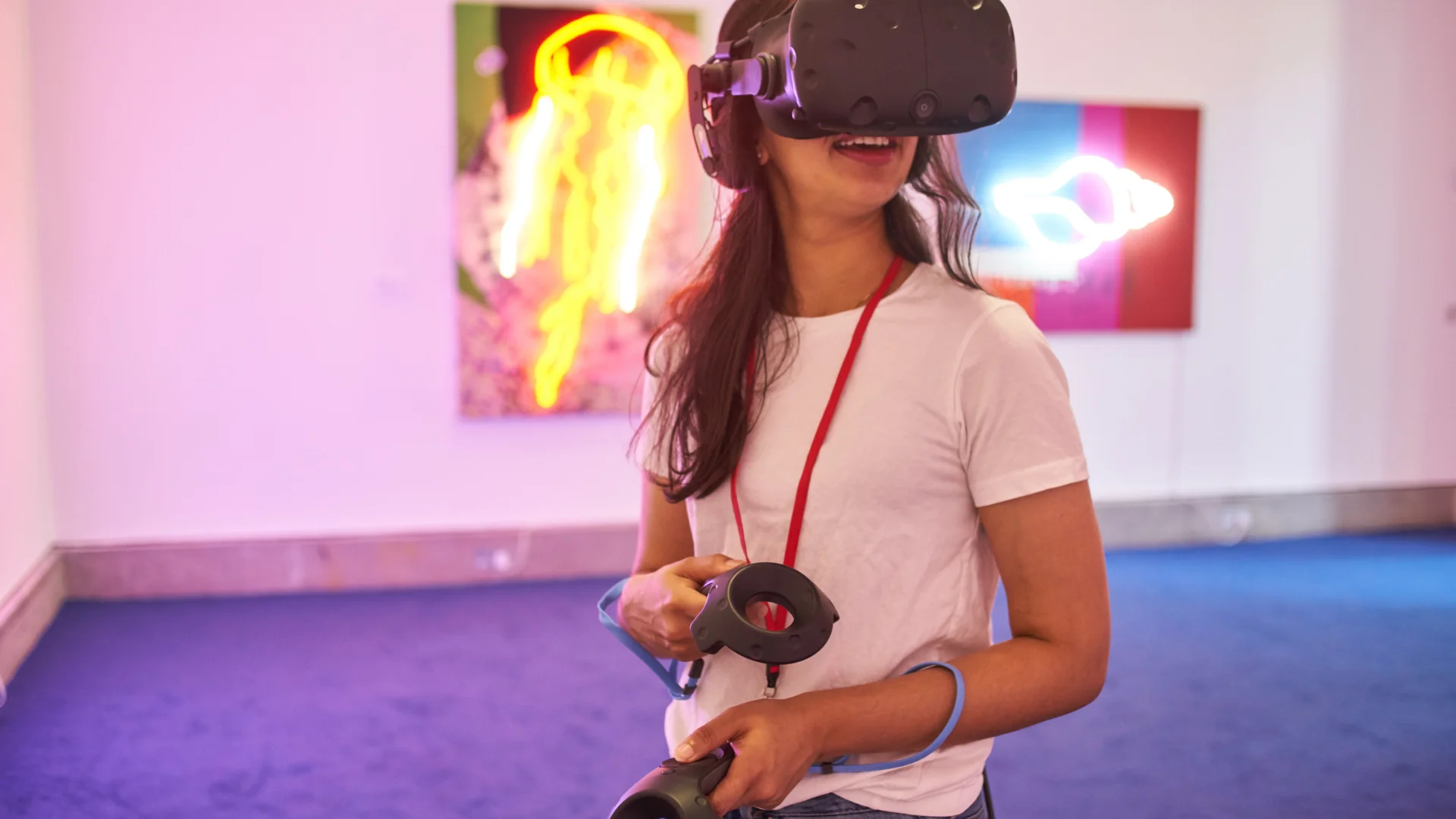 Person wearing VR headset and holding controllers