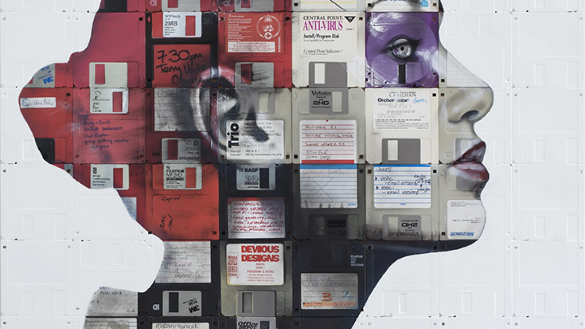 Devious Designs profile of woman superimposed with floppy discs by Nick Gentry