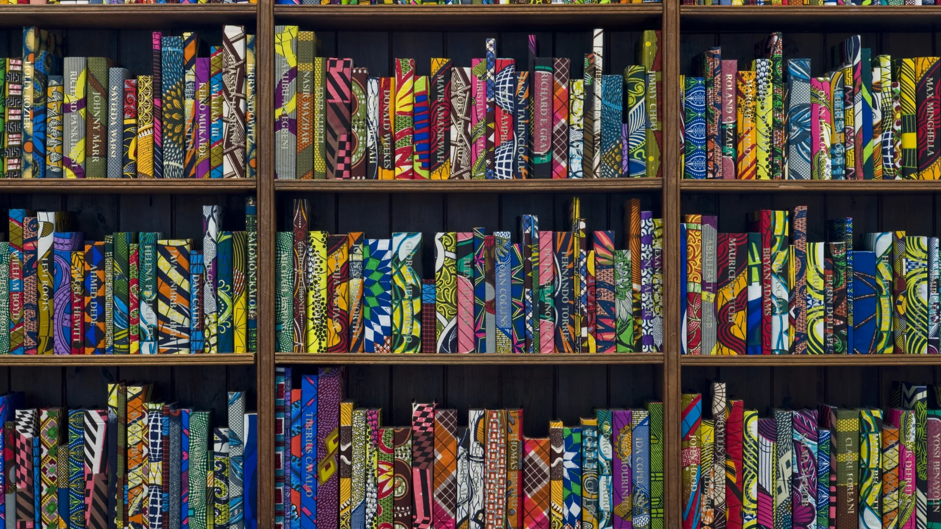 A bookcase with colourful books
