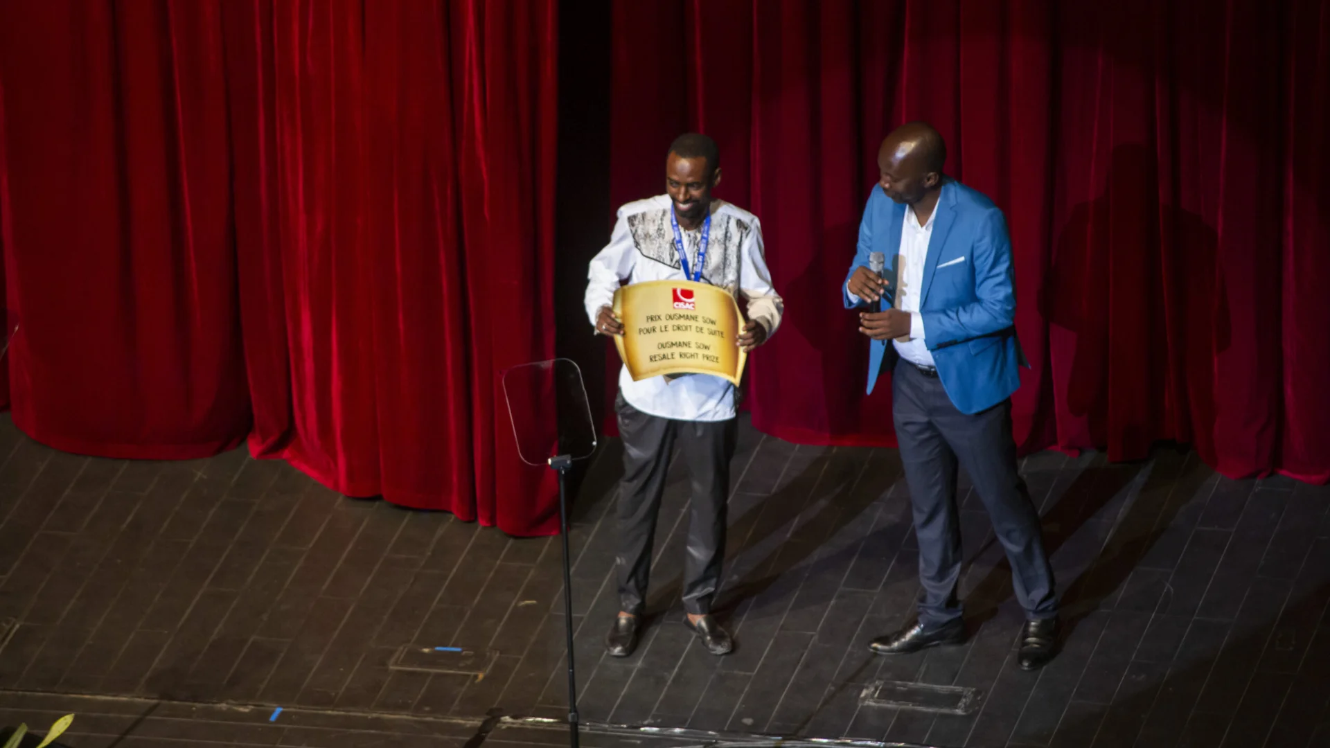 Award ceremony staff with two presenters