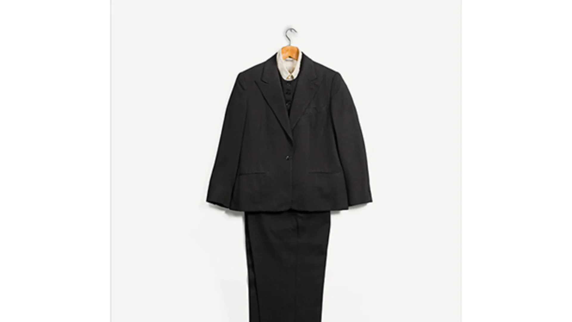 Penguin book cover dark suit on a hangar