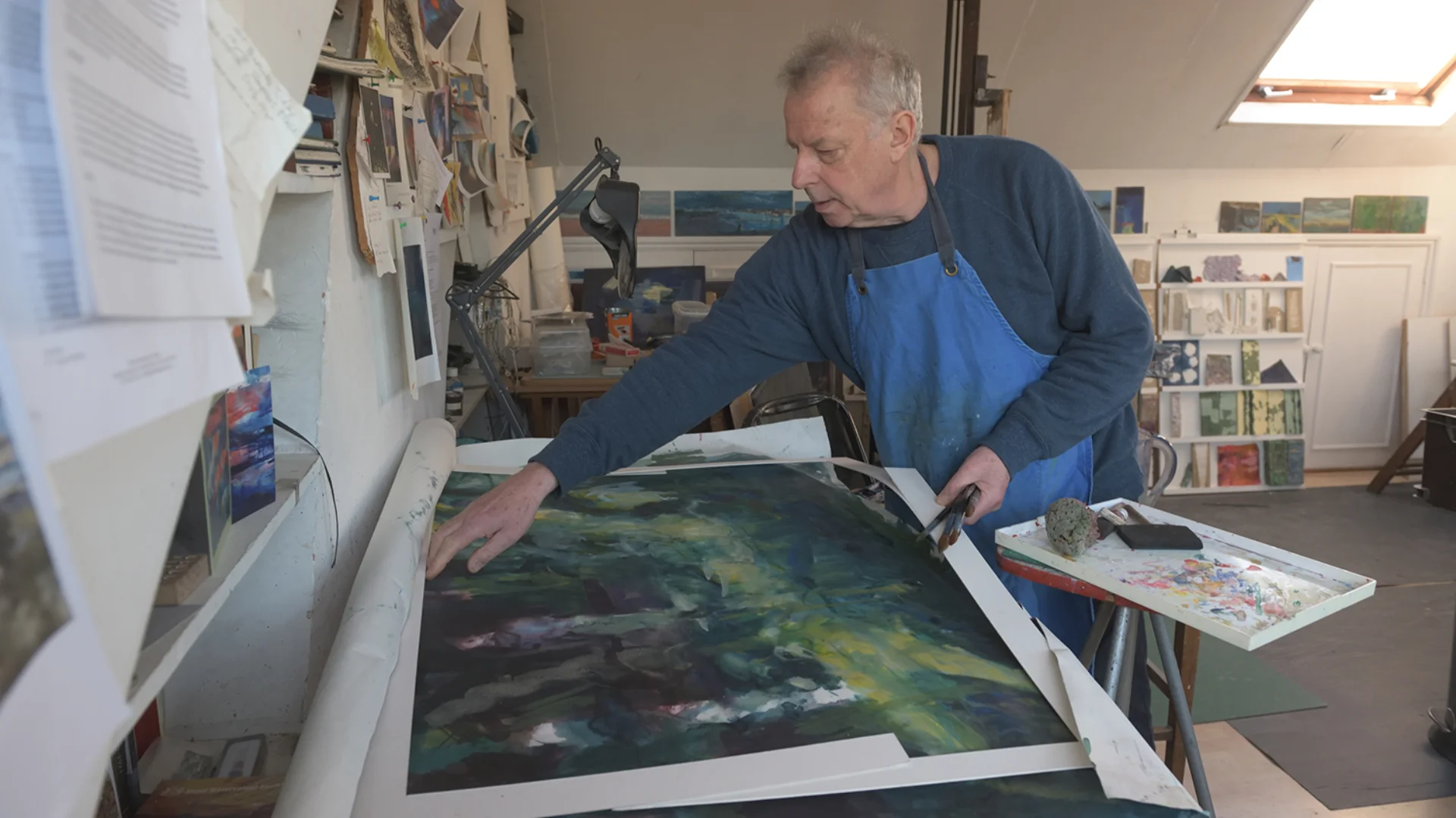 Artist working on piece in workshop