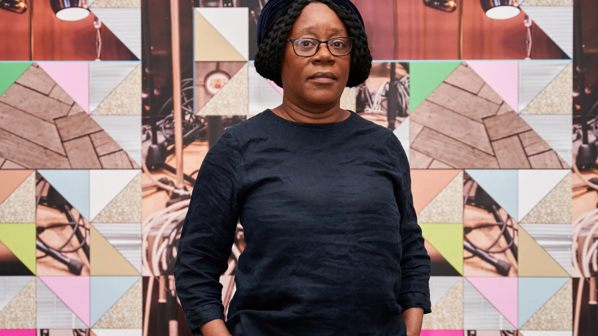 Sonia Boyce stood in front of her art work, Feeling Her Way, 2023, Leeds Art Gallery
